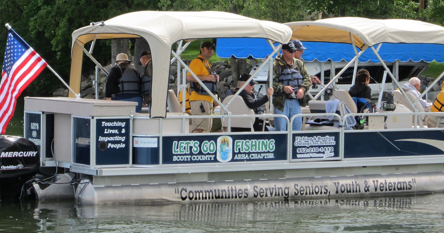 A group of veterans and Let's Go Fishing (LGF) volunteers gather at Cedar Lake Farm Regional Park in New Prague for the Scott County chapter's first pontoon ride June 1. Photo by Janice Bitters, Special to the Star Tribune