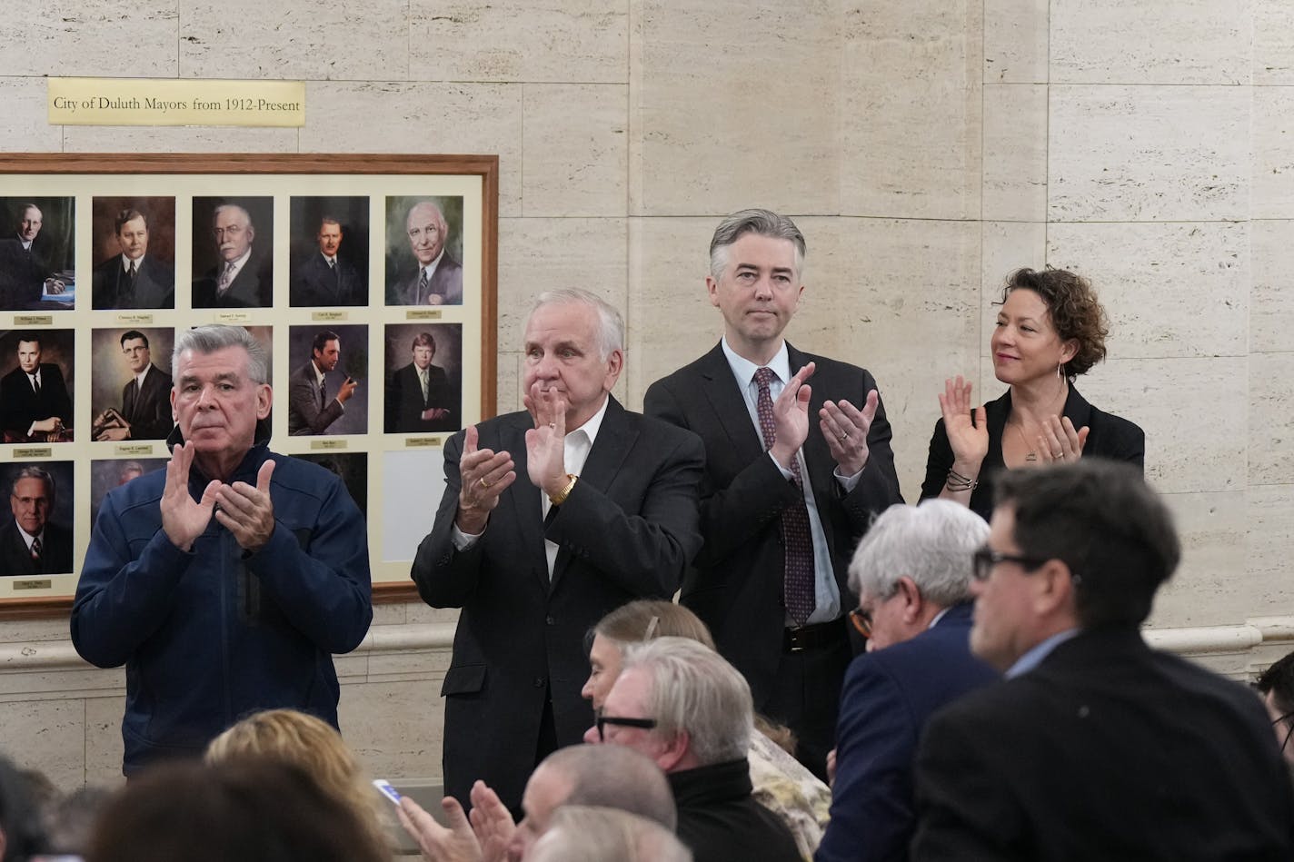 Former Duluth Mayors, John Fedo, Gary Doty, Don Ness, Emily Larson, applauded after Roger Reinert was sworn in at City Hall. Tuesday, Jan. 2, 2024 Duluth, Minn. Roger Reinert is sworn in as mayor of Duluth at City Hall ceremony