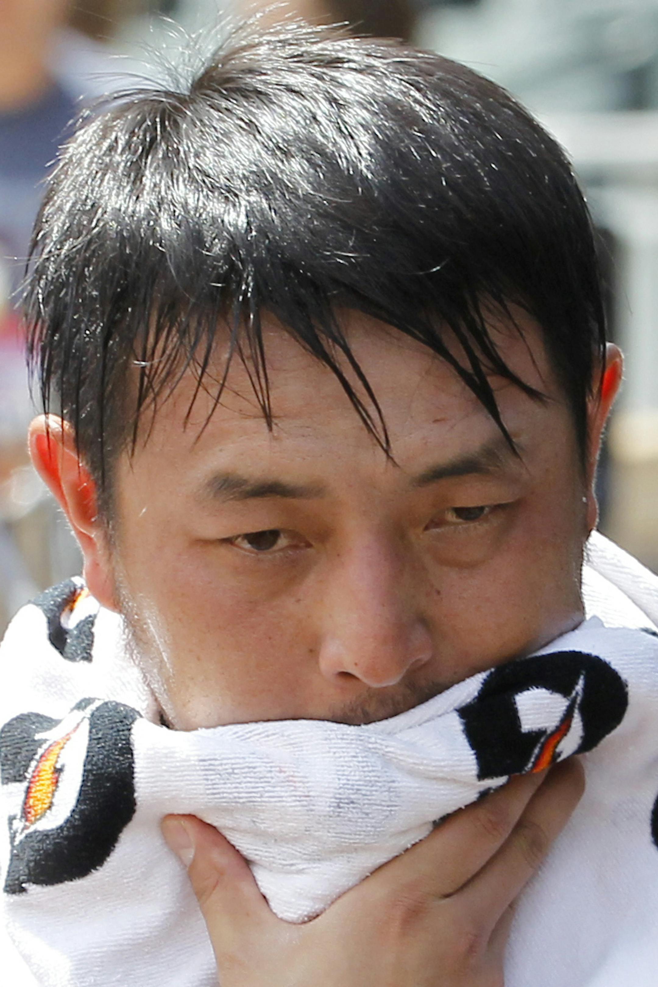 Seattle Mariners starting pitcher Hisashi Iwakuma walks through the dugout before a baseball game against the Minnesota Twins in Minneapolis, Sunday, Aug. 2, 2015. (AP Photo/Ann Heisenfelt)
