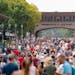Thousands of people move down Liggett Street on Thursday, the first day of the Minnesota State Fair in Falcon Heights.