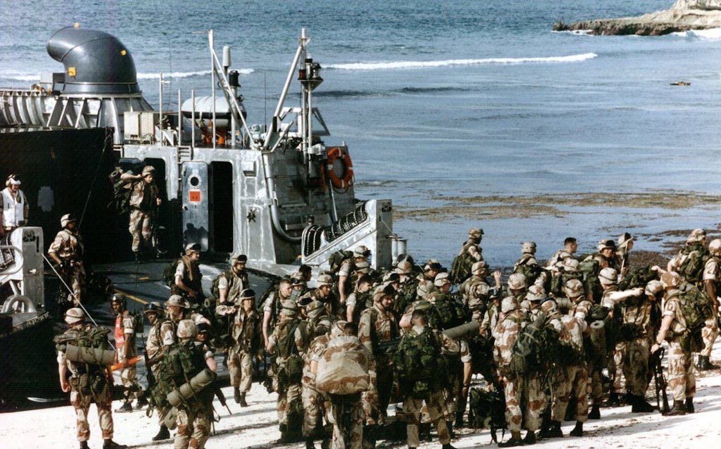 (NNS1-SEP12) Marines of the 1st Battalion, 2nd Marine Regiment come ashore in Somalia in March 1993. Such missions were mandated by a U.S. national security strategy crafted in 1992 by then-Defense Secretary Dick Cheney. SEE ``MILITARY-STRATEGY'' (Newhouse), transmitted Sept. 12.