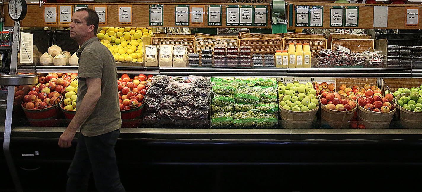 Produce manager Dean Schladweiler tended to fruits and vegetables at The Wedge Natural Foods Co-Op in Minneapolis. ] JIM GEHRZ &#x201a;&#xc4;&#xa2; jgehrz@startribune.com / Minneapolis, MN / May 8, 2014 / 10:00 AM / BACKGROUND INFORMATION: Target and Wal-Mart both announced an expansion of their assortment of organic and natural foods and products last month. Experts are wondering if increased demand will lower prices, but several hurdles remain.