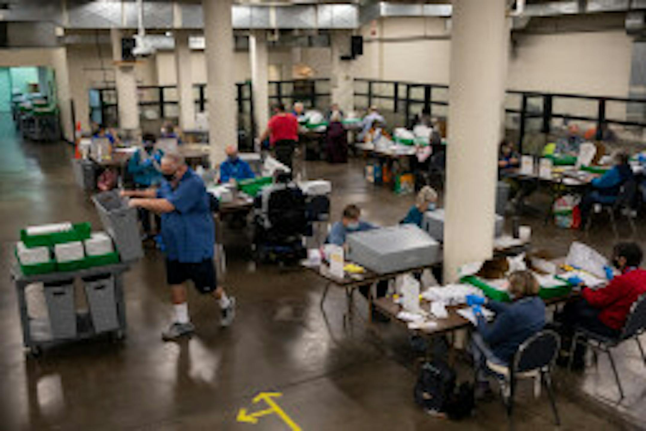 In this Nov. 3, 2020 file photo, election workers organize ballots at the Multnomah County Elections Division in Portland, Ore. Oregon's elections director was abruptly fired in a text message by the secretary of state after he pointed out serious issues with the state's aging and vulnerable technology for running elections.