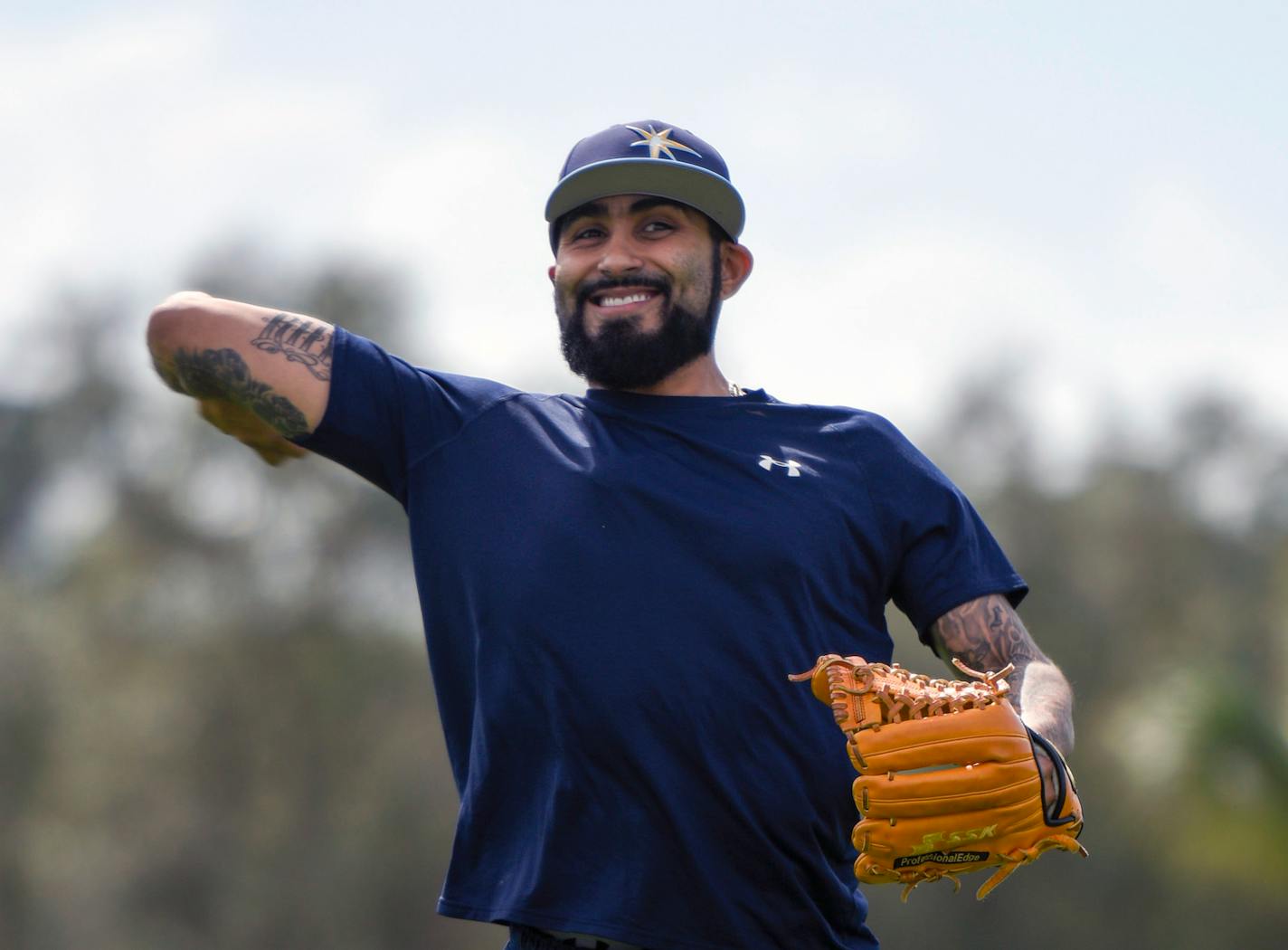 Tampa Bay Rays relief pitcher Sergio Romo throws the ball at the baseball teams spring training facility in Port Charlotte, Fla., Tuesday, Feb. 13, 2018. (Chris Urso/Tampa Bay Times via AP)