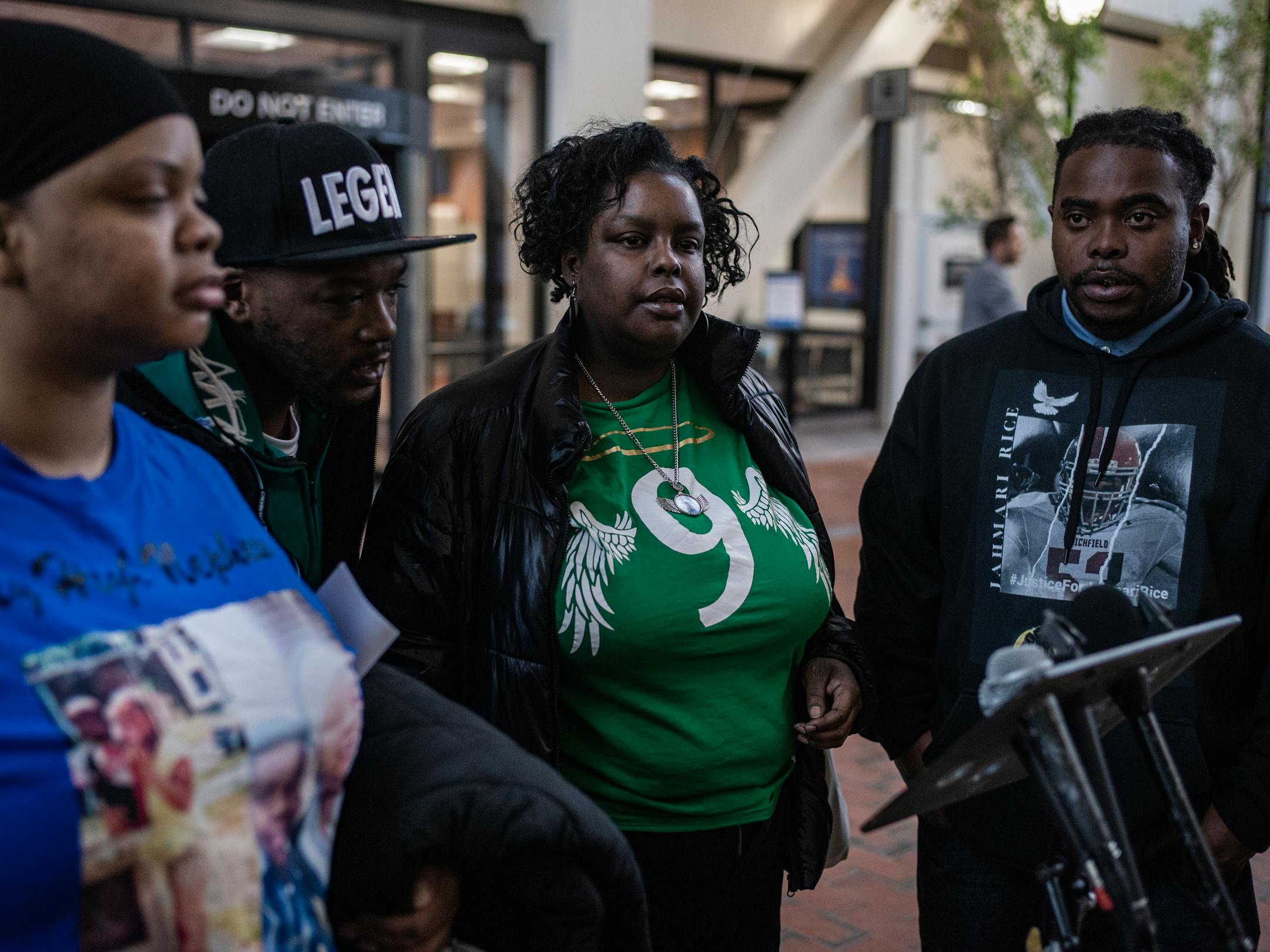 DeShaun Hill Jr.'s parents, DeShaun Hill and Tuesday Sheppard, middle, join Jamine Hollins, far left, and Cortez Rice, far right at a news conference after the sentencing.