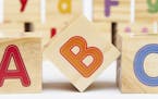 iStock
Spelling blocks toys with ABC in the foreground.