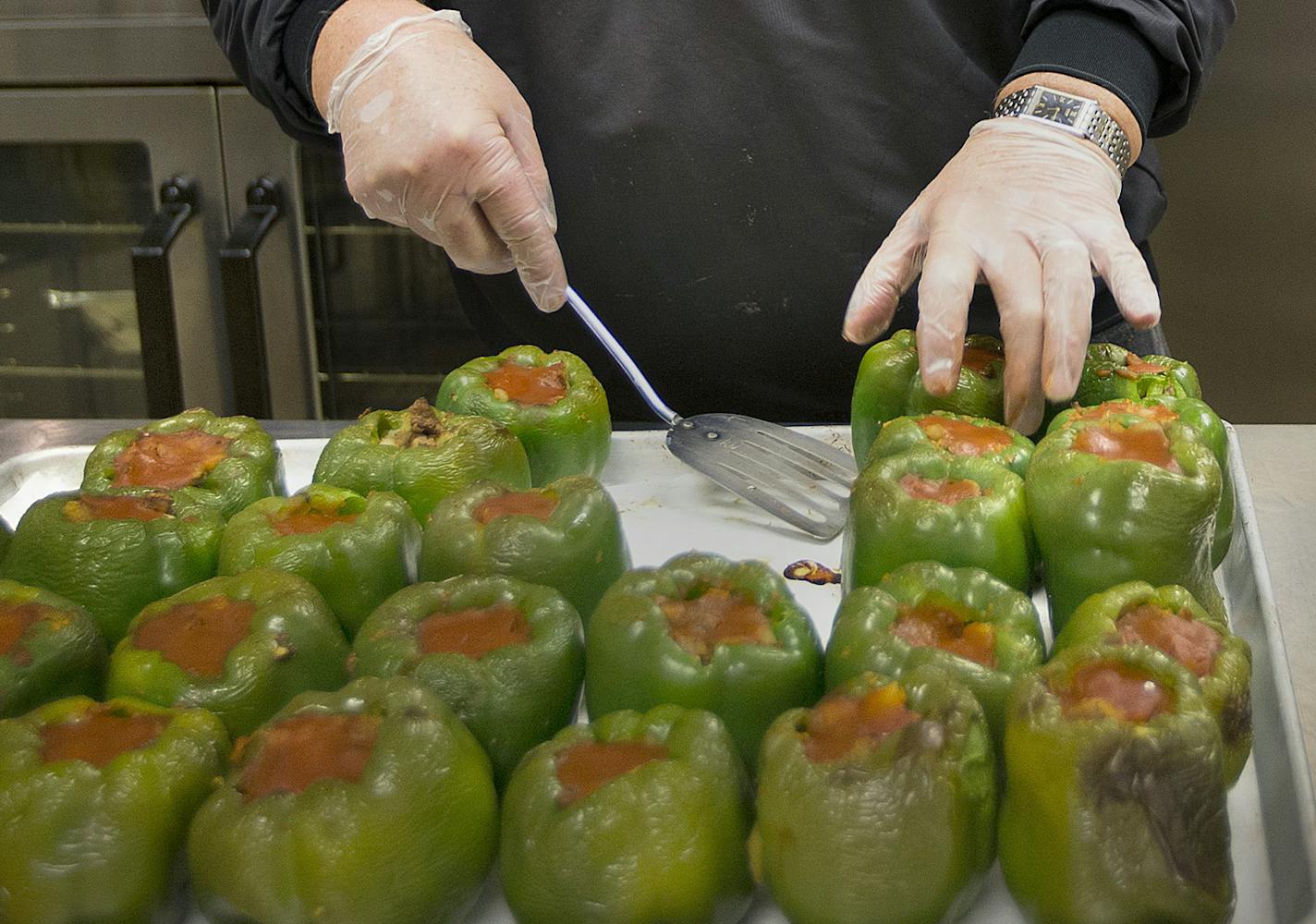 John Deal helped prepare stuffed peppers that were to be served at a Loaves and Fishes meal on Tuesday, November 24, 2015, at Eastern Lutheran Church in Eagan, Minn. ] RENEE JONES SCHNEIDER &#xef; reneejones@startribune.com ORG XMIT: MIN1511241953020227