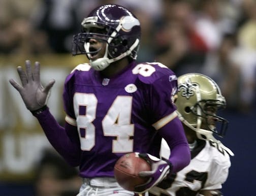 Vikings receiver Randy Moss reacts after catching a touchdown pass in 2001.