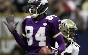 Vikings receiver Randy Moss reacts after catching a touchdown pass in 2001.