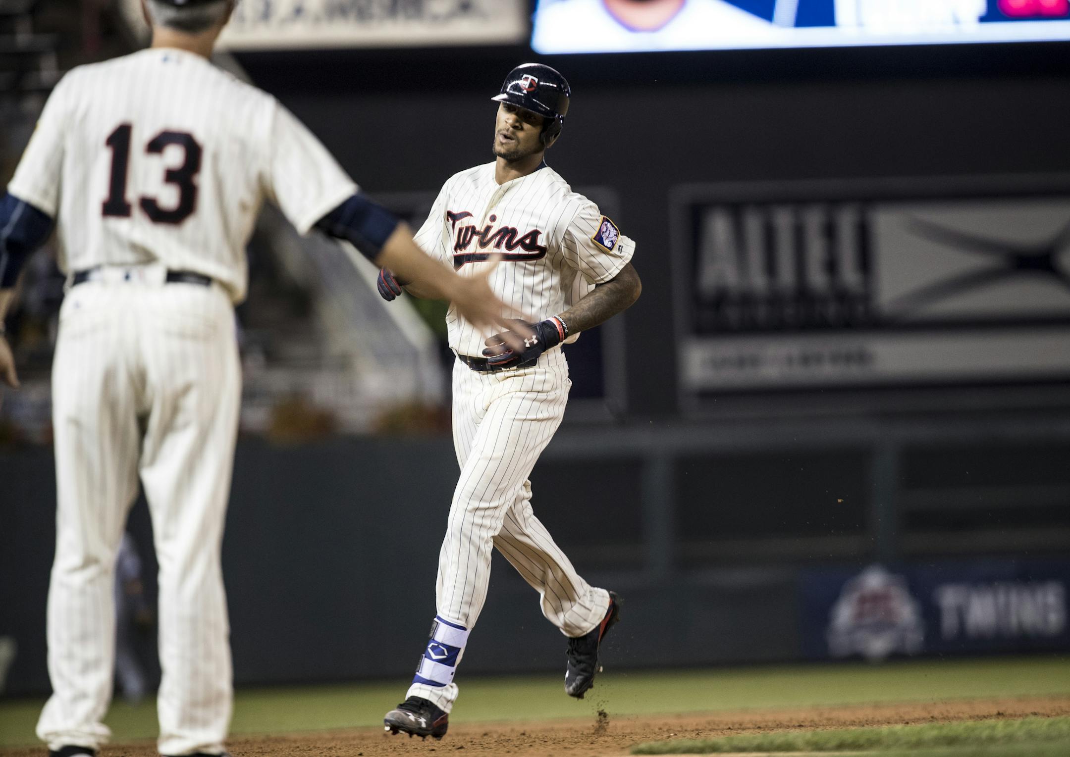 Byron Buxton ran past third to give third base coach Gene Glynn a high five after an eighth inning home run. ] RENEE JONES SCHNEIDER • renee.jones@startribune.com The Twins hosted the Kansas City Royals at Target Field in Minneapolis, Minn. on Wednesday, September 7, 2016.