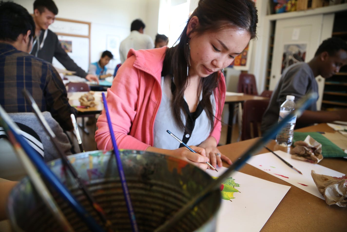 Pai Vang 19, and her classmates at Leap Academy Highs School worked on art projects Friday March 13, 2015 in St. Paul, Minnesota. ] The student body has seen a number of changes in student population the past twenty years, reflecting a larger trend that Minnesota demographics are changing as well.] Jerry Holt/ Jerry.Holt@Startribune.com