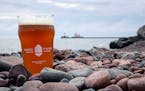 A Canal Park Brewery offering is pictured along the shores of Lake Superior.