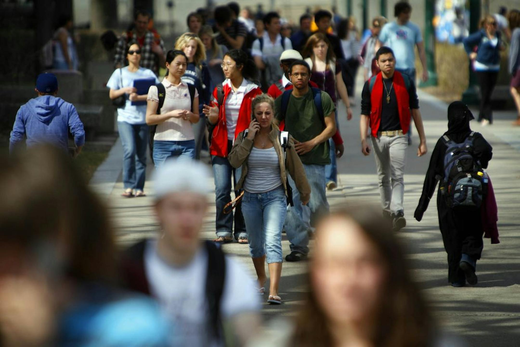 Students crowded the sidewalk at the University of Minnesota.