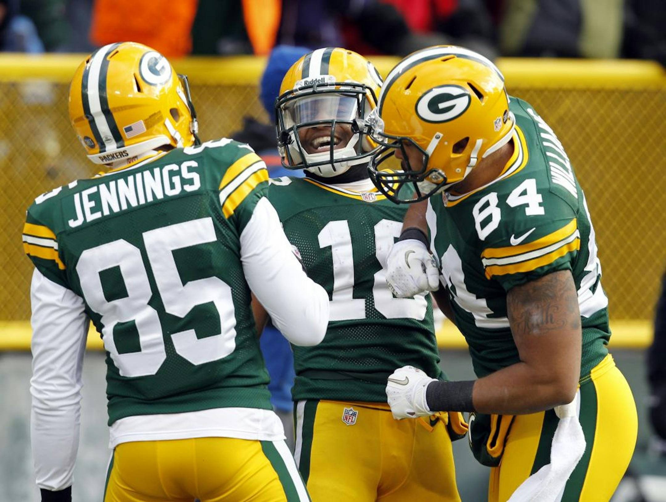 Randall Cobb, center, caught a touchdown pass in Sunday's blowout of the Titans, but the Packers' leading receiver later injured his ankle.