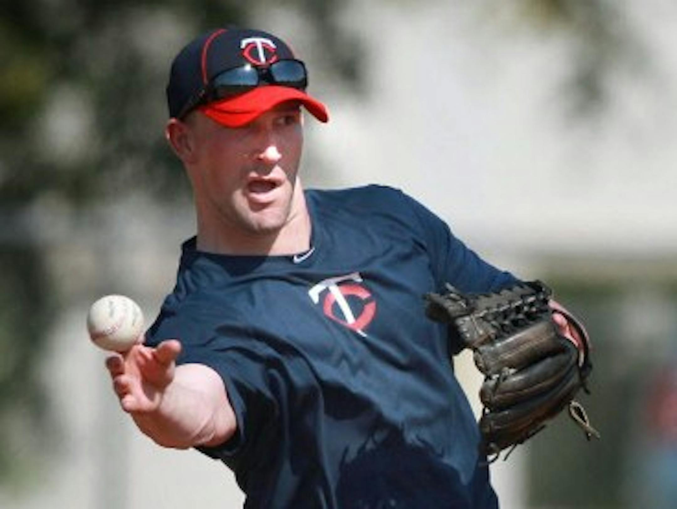 Brian Dinkelman threw a ball one time with the exact motion and expression of a bartender sliding a beer to a patron.