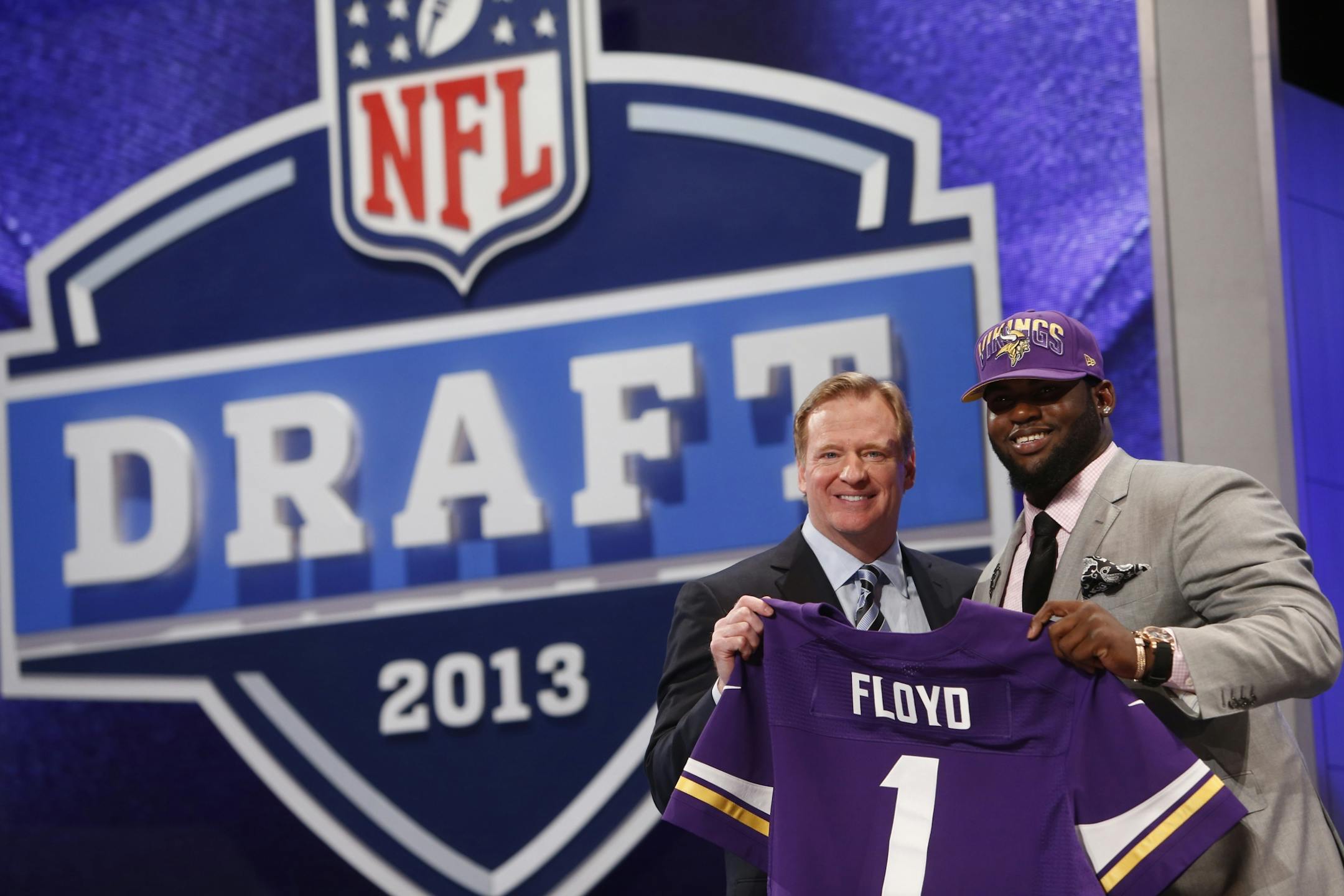 Sharrif Floyd, from Florida, stands with NFL Commissioner Roger Goodell after being selected 23rd overall by the Minnesota Vikings