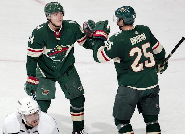 Mikael Granlund and Jonas Brodin celebrated an empty net Granlund goal in the third period.
