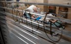 A patient rested in a COVID-positive room in the St. Cloud Hospital emergency room as she waited for an ICU bed to open up in November. CentraCare has