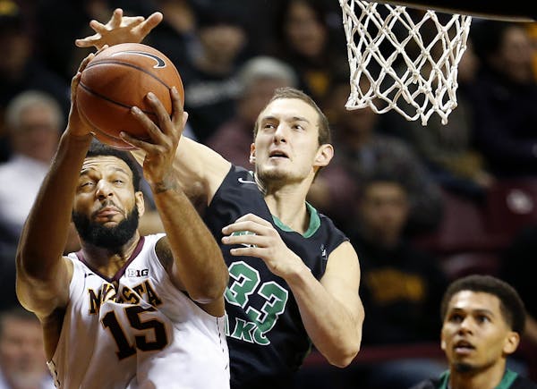 Gophers Maurice Walker (15) was fouled by Chad Calcaterra (33) in the first half.