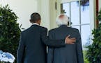 President Barack Obama and Sen. Bernie Sanders walk along the colonnade adjacent to the Rose Garden at the White House on Thursday, June 9, 2016, in W