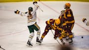 Clarkson's Dominique Petrie (29) celebrates her winning goal in the fourth overtime against the Gophers women's hockey team to end the NCAA quarterfin