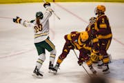 Clarkson's Dominique Petrie (29) celebrates her winning goal in the fourth overtime against the Gophers women's hockey team to end the NCAA quarterfin