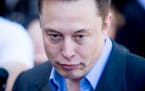 Tesla CEO Elon Musk speaks with members of the media at Tesla's headquarters in Palo Alto, Calif., Thursday, April 30, 2015. (AP Photo/Noah Berger)