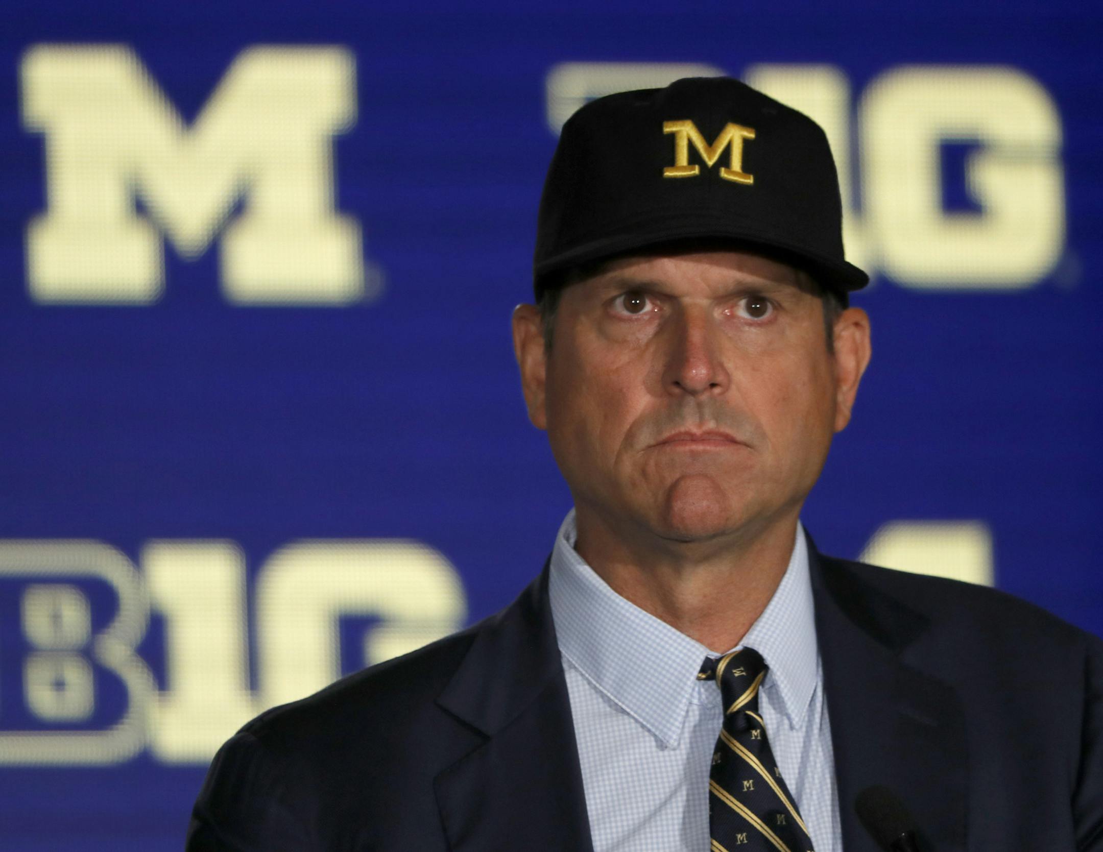 Michigan head coach Jim Harbaugh listens to a question during the Big Ten Conference NCAA college football media days Friday, July 19, 2019, in Chicago. (AP Photo/Charles Rex Arbogast)