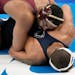 Minnesota's Gable Steveson, top, takes on Penn State's Greg Kerkvliet during their 285-pound match in the quarterfinal round of the NCAA wrestling cha