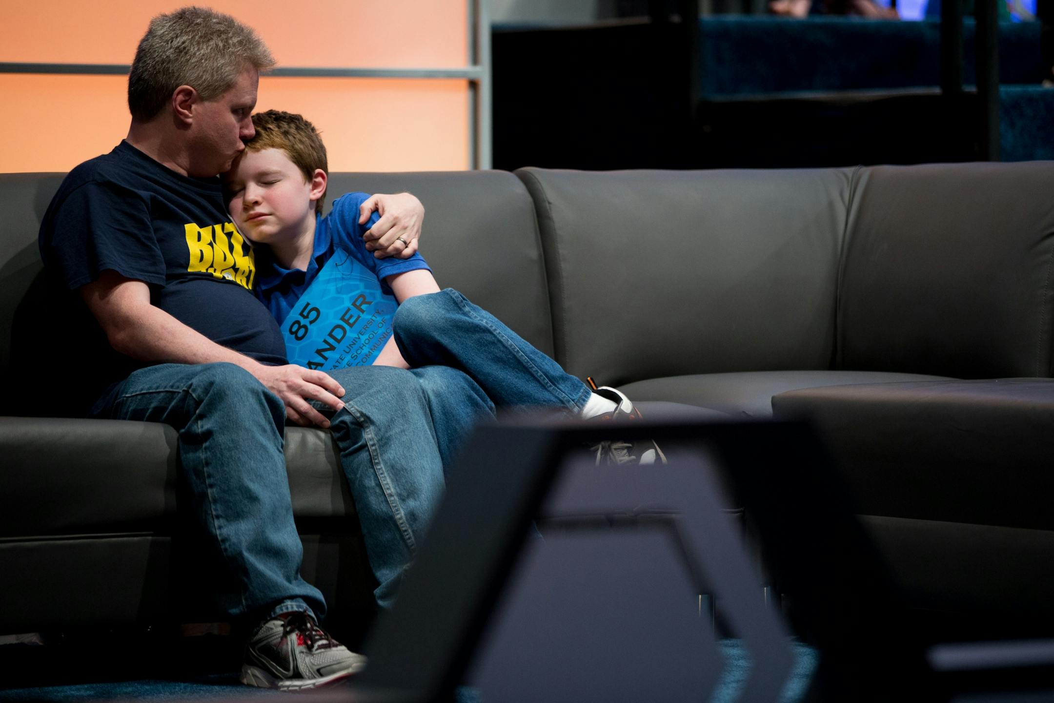 Zander Reed, 12, of Ames, Iowa, gets a kiss from his father, Todd, after incorrectly spelling his word during the 2015 Scripps National Spelling Bee, Wednesday, May 27, 2015, in Oxon Hill, Md.
