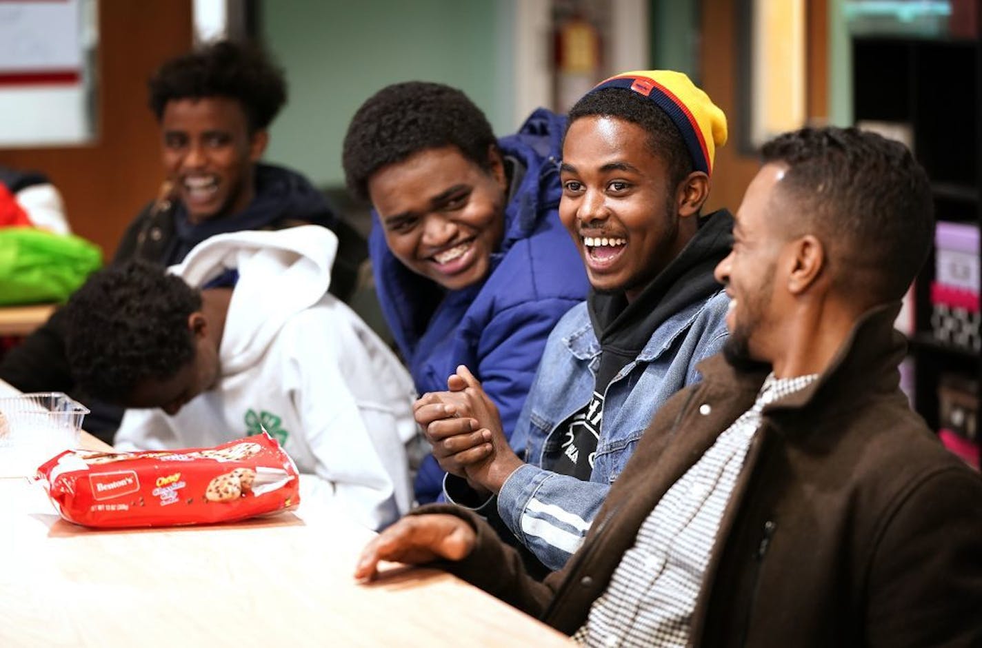 Abdinur Omar, second from right, 18, laughed during a youth discussion group about cross cultural connections.