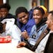 Abdinur Omar, second from right, 18, laughed during a youth discussion group about cross cultural connections.