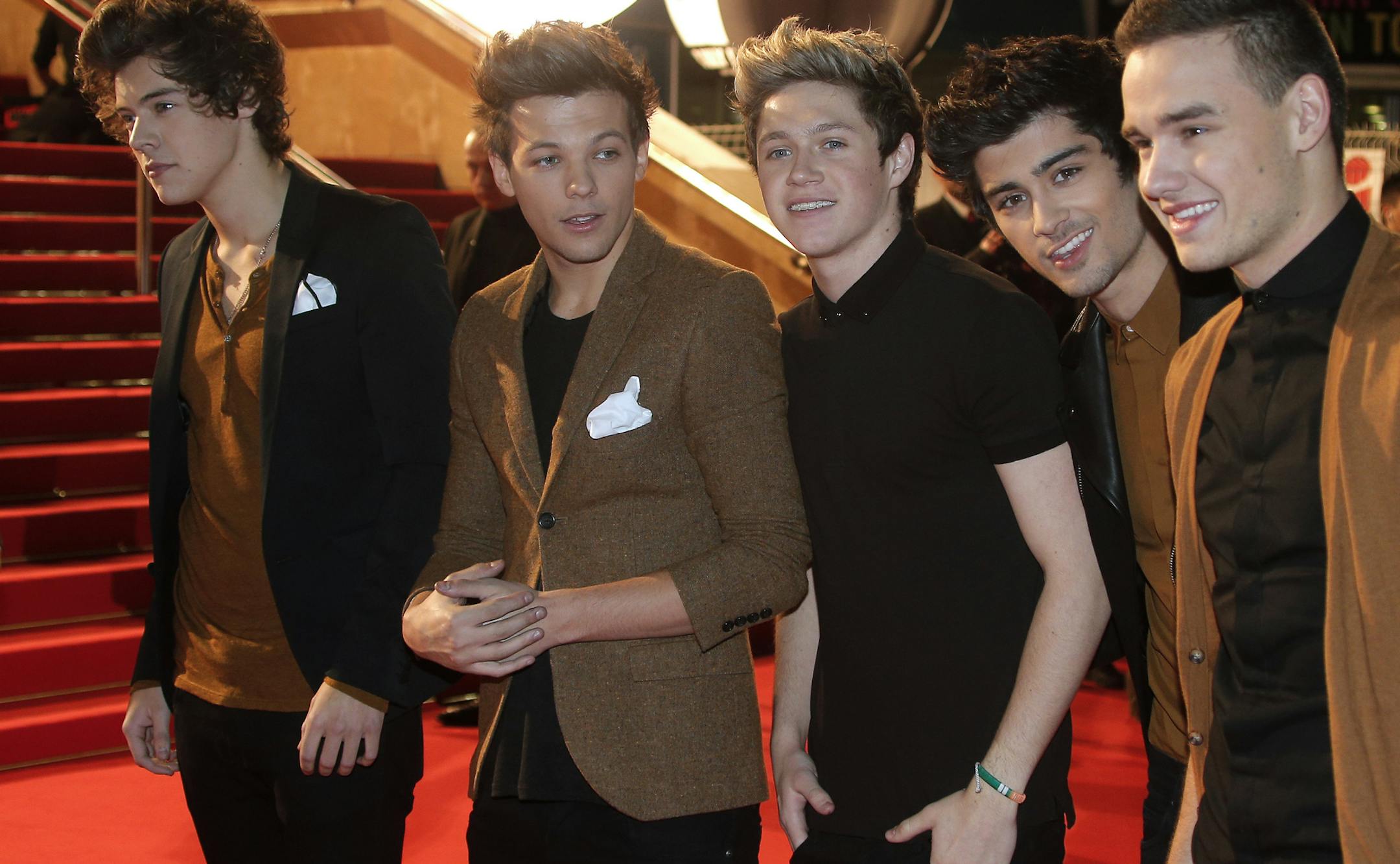 British pop group One Direction arrive at the Cannes festival palace, to take part in the NRJ Music awards ceremony, Saturday, Jan. 26, 2013, in Cannes, southeastern France.