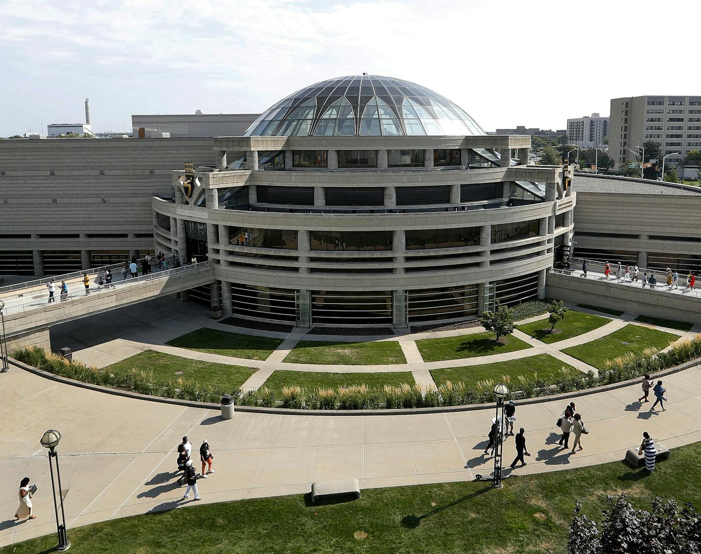 Please walk into the Charles H. Wright Museum of African American History during a public visitation for Aretha Franklin in Detroit, Tuesday, Aug. 28, 2018. Franklin died Aug. 16, of pancreatic cancer at the age of 76. (AP Photo/Paul Sancya)