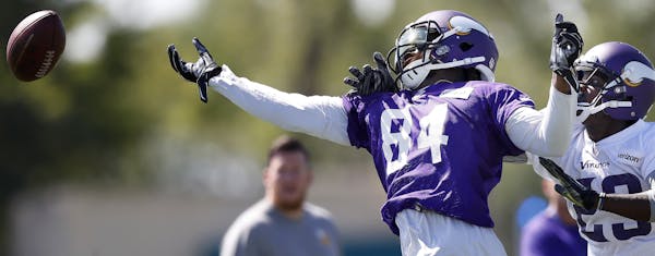 Cordarrelle Patterson (84) was defended by Terence Newman (23) during the afternoon practice on the first day of training camp in Mankato. ] CARLOS GO