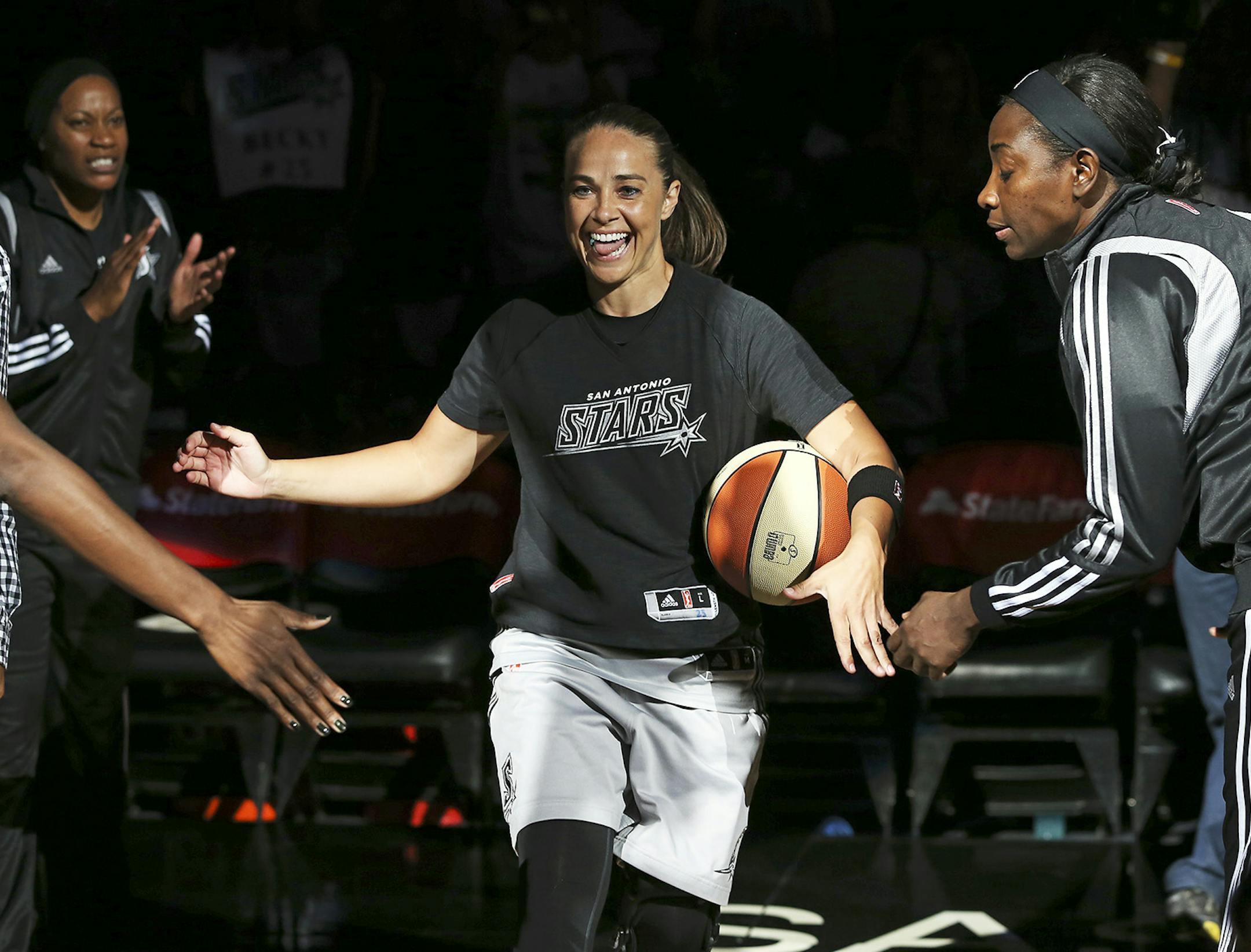 San Antonio Stars' Becky Hammon is introduced as the Stars play the Minnesota Lynx in a WNBA basketball game Friday, Aug. 15, 2014, in San Antonio. (AP Photo/The San Antonio Express-News, Tom Reel)