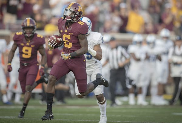 Minnesots wide receiver Tyler Johnson (6) runs into the end zone with a 61-yard touchdown reception during the first quarter against Buffalo at TCF Ba