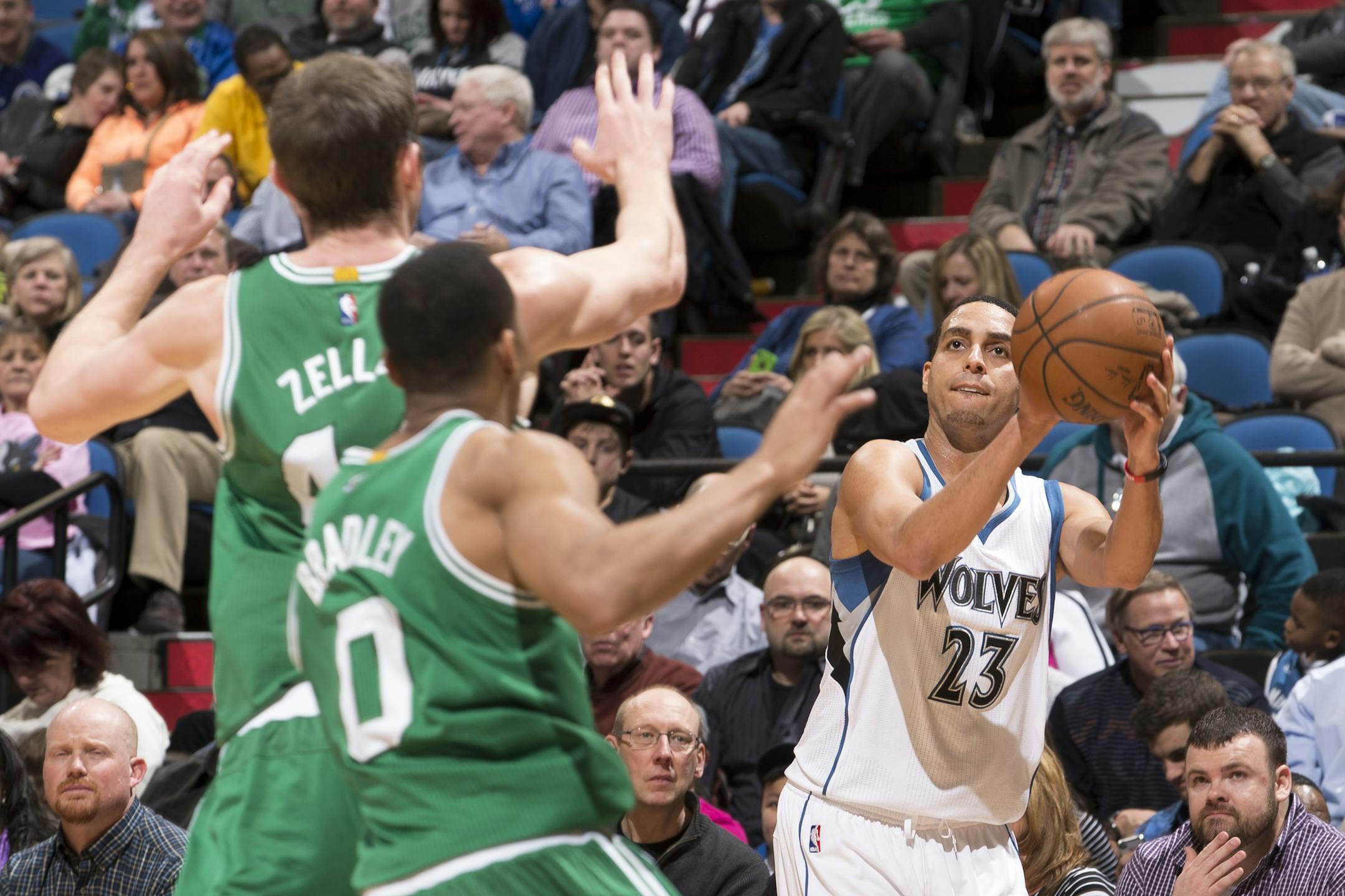 Minnesota Timberwolves guard Kevin Martin (23) attempts a shot over Celtics center Tyler Zeller (44) and guard Avery Bradley (0) during the third quarter. ] (Aaron Lavinsky | StarTribune) The Minnesota Timberwolves play the Boston Celtics Wednesday, Jan. 28, 2015 at Target Center.