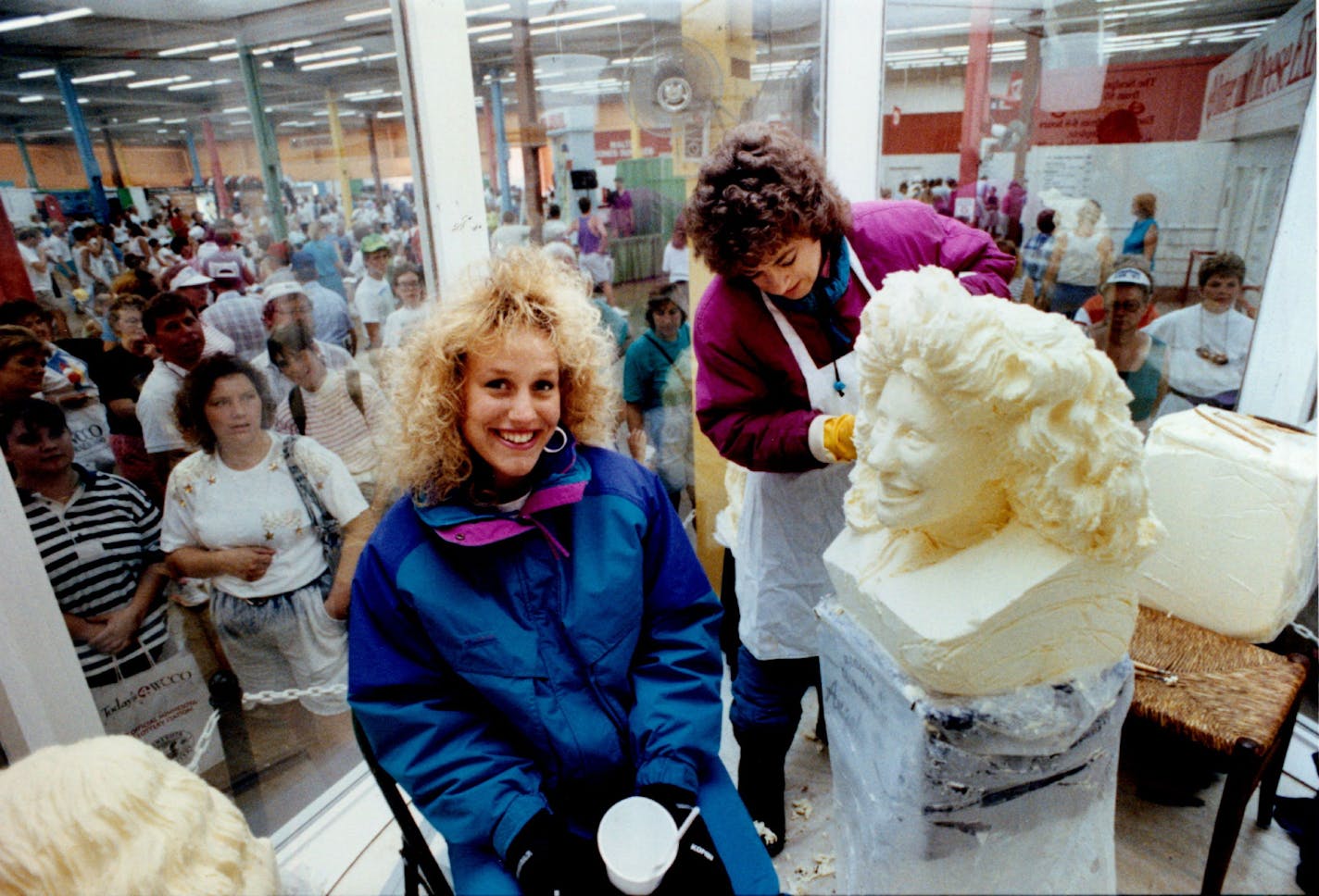 August 27, 1991 Princess Kay of the Milky Way Candidate Sculpted in Butter Outside at the State Fair it was in the 90's, but inside a refrigerated booth at the Fair it was only 38 degrees and Angela Kern, 19, representing the Waseca area and one of eleven candidates for Princess Kay of the Milky way was being butter by Linda Christensen. Kern is a student at St. Cloud State University and wants to be in Public Relations when she grows up. Christensen has sculpted ALL the Princess Kay candidates for the last 19 years. The block of butter she starts out with ways 85 lbs and it takes her about 6 to 8 hours to do the job. August 28, 1991 Mike Zerby, Minneapolis Star Tribune