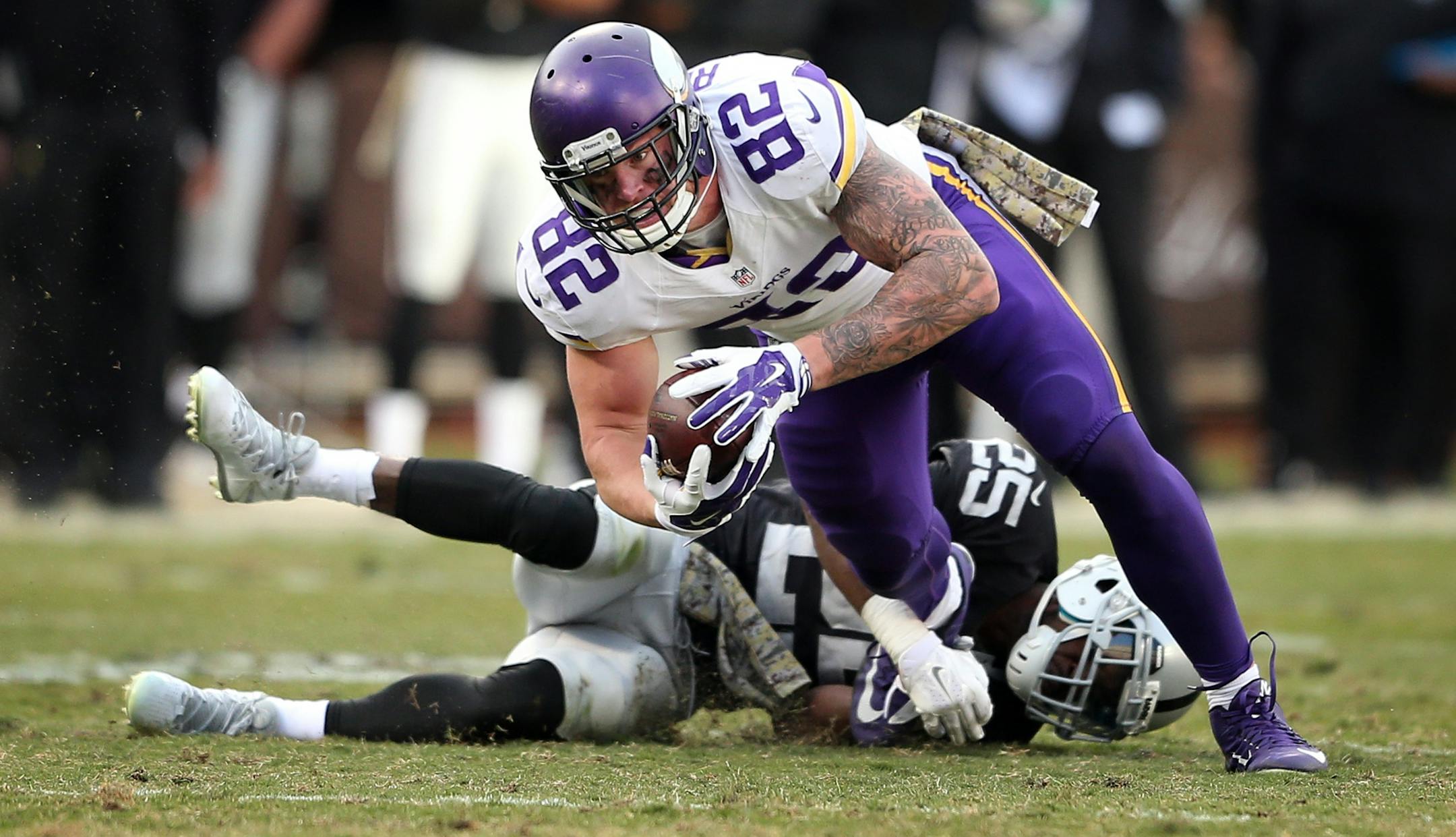 Vikings tight end Kyle Rudolph picked up a first down as he was tackled by Raiders cornerback D.J. Hayden on Sunday.