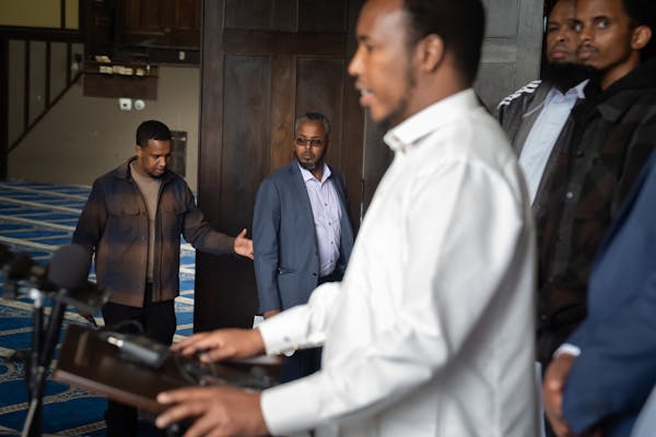 Osman Ahmed is helped into the mosque as Imam Abdirazak Kaynin speaks at the press conference Friday, May 24, 2024  Minneapolis, Minn. CAIR-Minnesota 