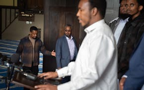 Osman Ahmed is helped into the mosque as Imam Abdirazak Kaynin speaks at the press conference Friday, May 24, 2024 Minneapolis, Minn. CAIR-Minnesota