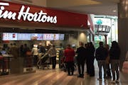 A line of customers goes out the door during the soft opening of the new Tim Hortons bakery at Mall of America, Nov. 15, 2016.