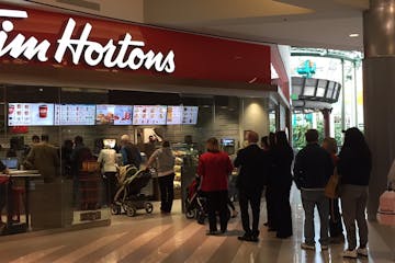 A line of customers goes out the door during the soft opening of the new Tim Hortons bakery at Mall of America, Nov. 15, 2016.