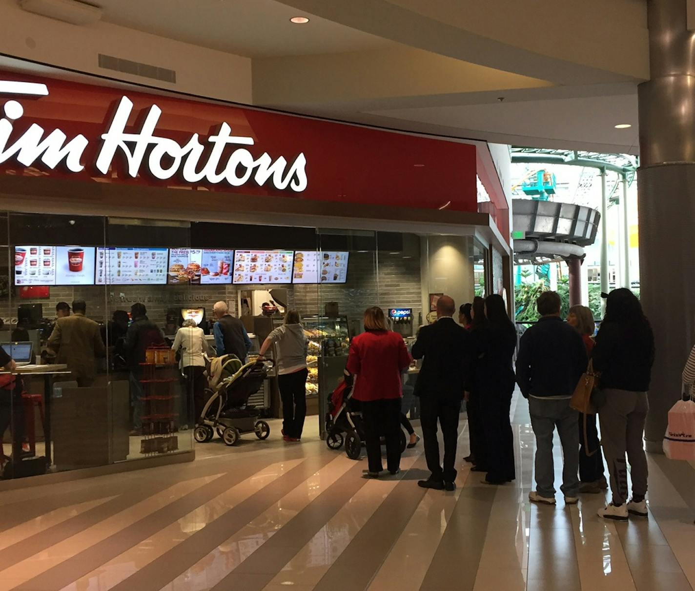 A line of customers goes out the door during the soft opening of the new Tim Hortons bakery at Mall of America, Nov. 15, 2016.