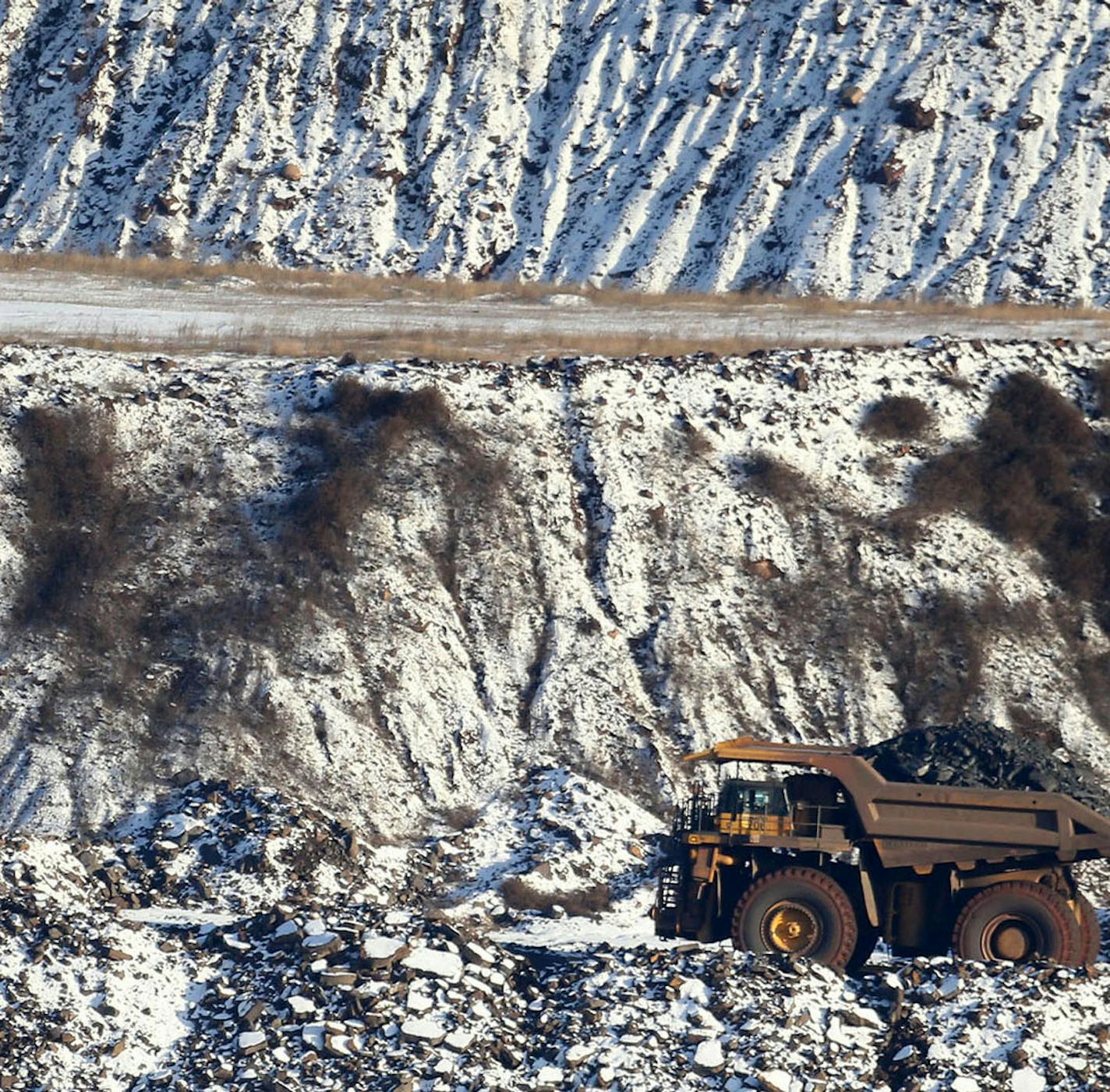 A view of Hull Rust Mine: the world's largest open pit mine, where a giant truck is seen carrying iron ore rocks Tuesday, Nov. 24, 2015, in Hibbing, MN.](DAVID JOLES/STARTRIBUNE)djoles@startribune.com Idled on the Iron Range, workers and entire communities are struggling at a time when the rest of Minnesota is enjoying peace and plenty. The Range has always been a land of booms and busts, but the latest downturn has stretched on so long the governor is calling for a special session to extend une