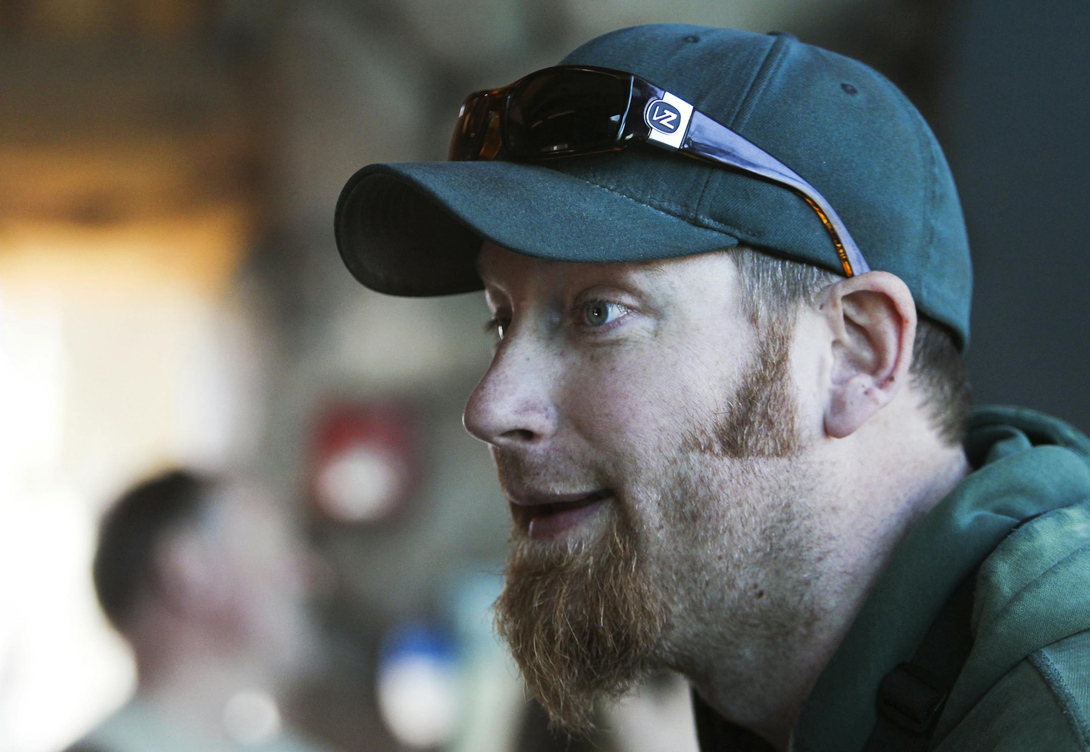 Minnesota Zoo keeper Ben Sutton does training with Kenai, a 7 year-old male brown (grizzly) bear, at the zoo's Russia Grizzly's Coast exhibit Thursday, April 4, 2013, in Apple Valley, MN. Sutton has been a zoo keeper at the Minnesota Zoo for 8 years and training of the bears offers them a type of enrichment for stimulation, public education and preparation for future procedures. While Sutton has a working relationship with the bears -- Grizzly's are among the world's largest animals, weighing up