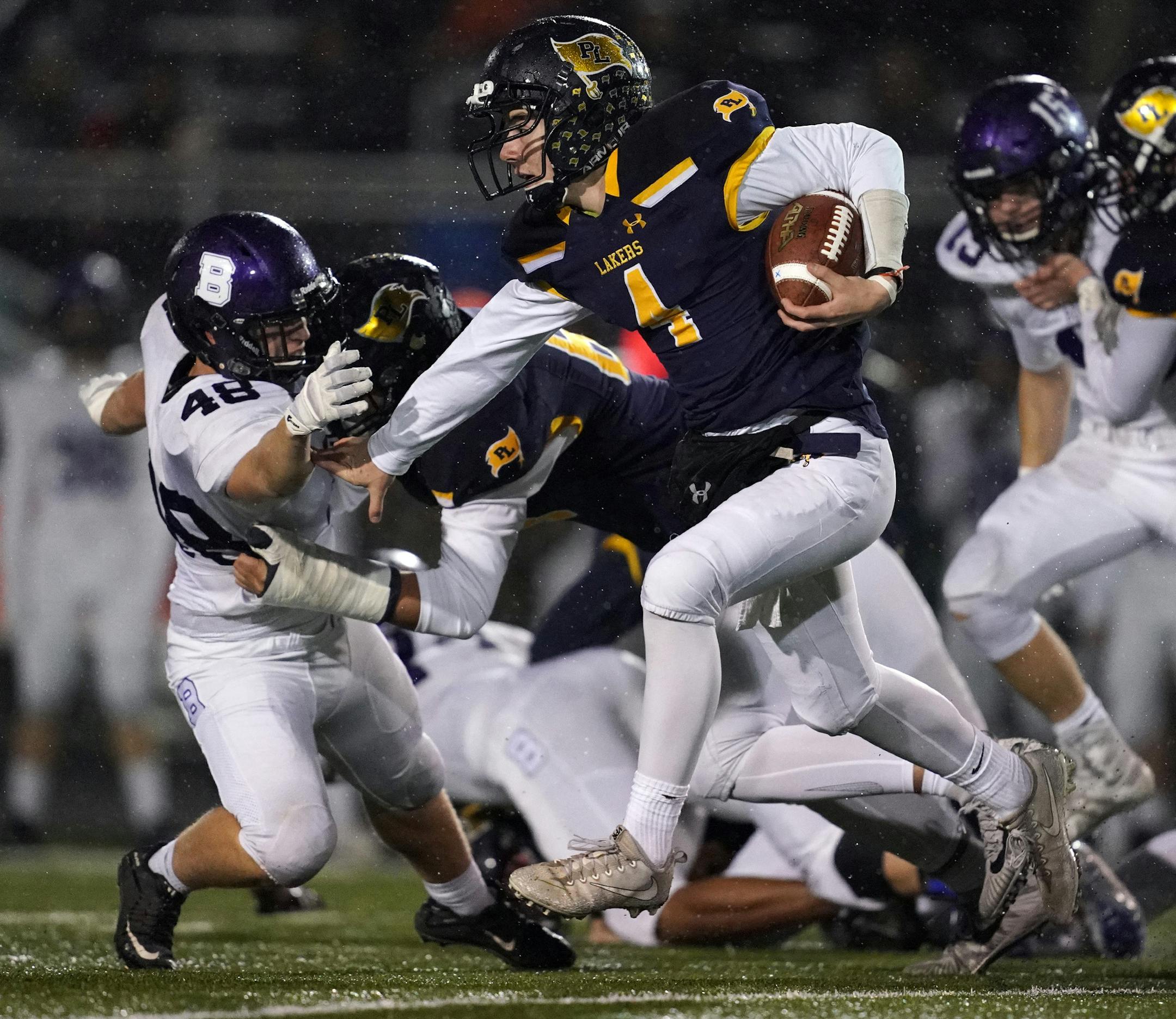 Prior Lake High School quarterback Colin O'Connor (4) ran with the ball as Buffalo High School linebacker Ty Zwack (48) reached out to try and make the tackle in the first half. ] ANTHONY SOUFFLE ï anthony.souffle@startribune.com Prior Lake High School played Buffalo High School in a Class 6A playoff game Friday, Oct. 26, 2018 at Prior Lake High School in Savage, Minn.