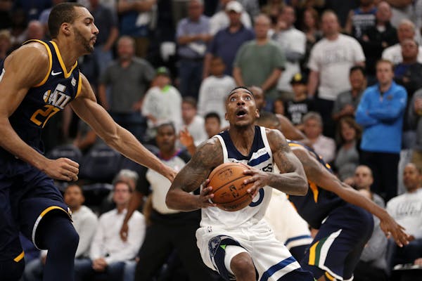 Timberwolves guard Jeff Teague drove to the basket as Jazz center Rudy Gobert defended in the second half Friday.