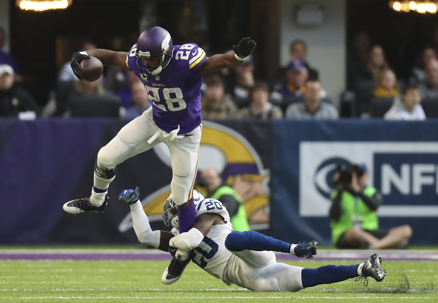 Vikings running back Adrian Peterson tried to step out of a tackle by Indianapolis Colts free safety Darius Butler ( after catching a pass for a one yard gain in December.